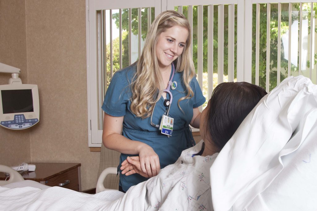 Nurse comforting patient