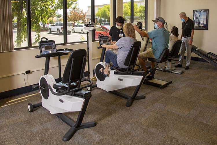 PT personal helping patient exercise